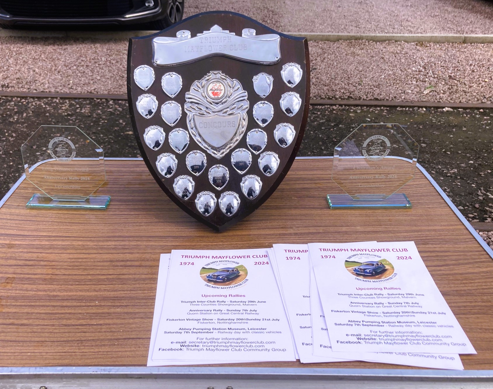 Awards laid-out on a table ready for giving to their recipients at the 2024 Triumph Mayflower Club annual rally.
